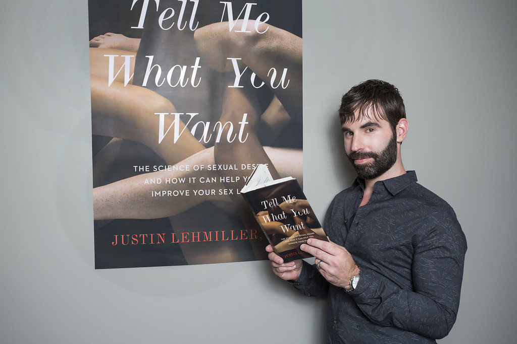 Justin Lehmiller with his book